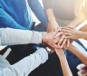 Hands together — teamwork and collaboration